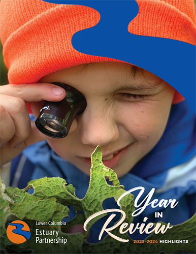 a child squints through a loupe at lettuce lichen