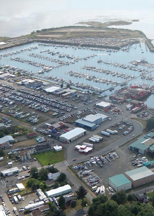 aerial shot shows full parking lots by the Ilwaco marina